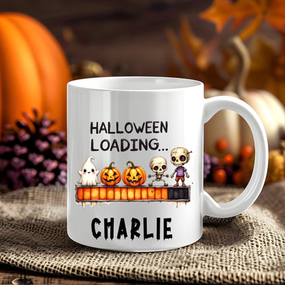 Personalised Halloween Loading Halloween 11oz mug showing a ghost, pumpkins, skeleton and zombie on a Halloween progress bar
