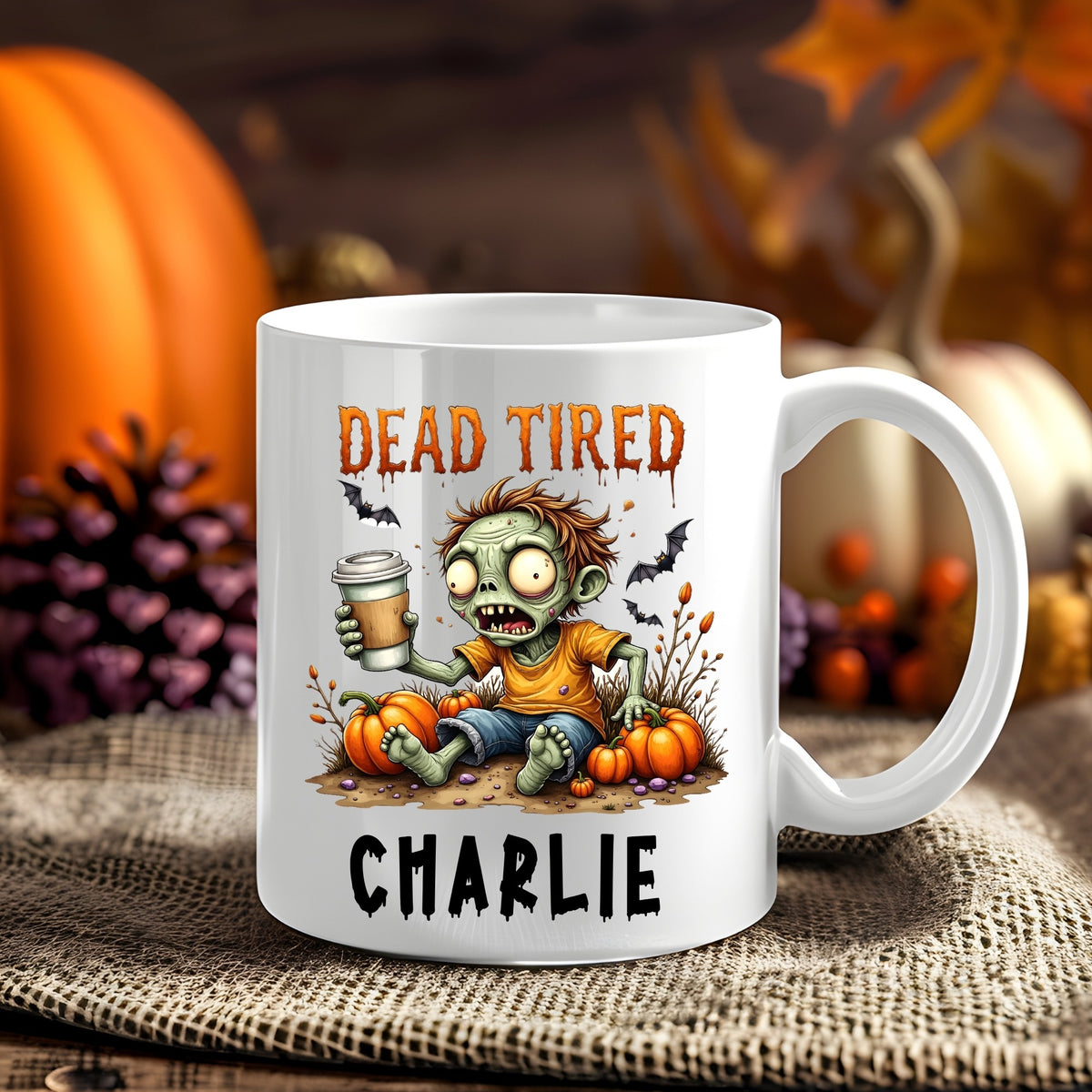 Personalised Dead Tired Zombie Halloween 11oz mug showing a tired cartoon zombie holding a takeaway coffee beside pumpkins