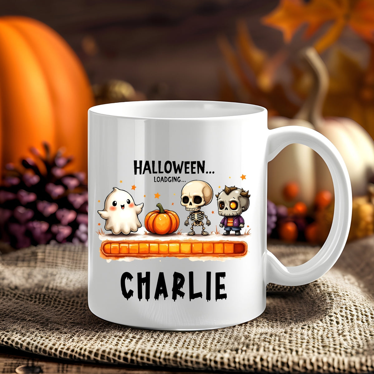 Personalised Halloween Loading Characters Halloween 11oz mug showing a ghost, jack-o'-lantern and spooky characters above an orange loading bar