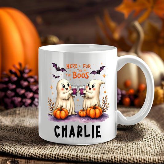 Personalised Here for the Boos Halloween 11oz mug showing two cute ghosts toasting drinks with pumpkins and bats