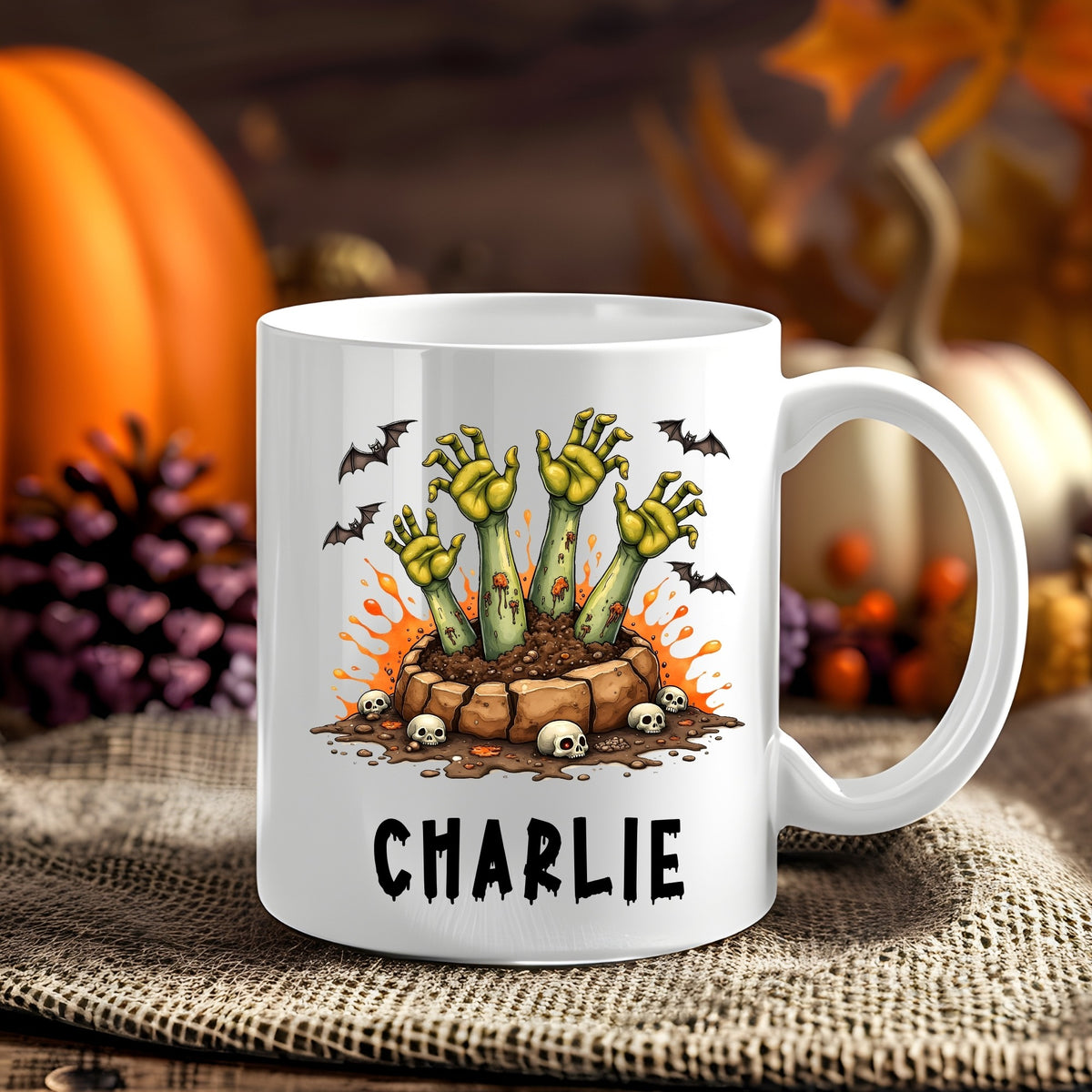 Personalised Zombie Hands Halloween 11oz mug showing green zombie hands rising from a grave with skulls and bats