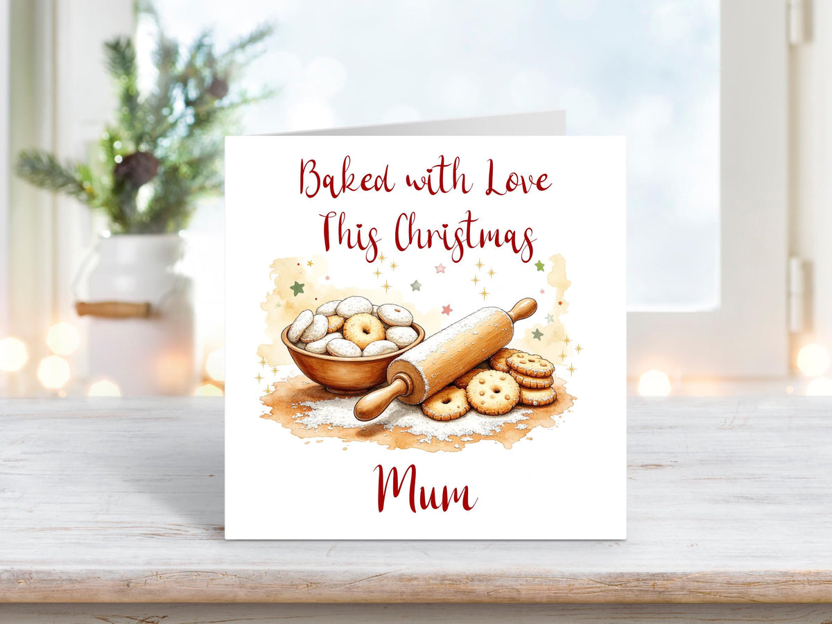 Christmas card featuring a bowl of biscuits, a rolling pin, and baked treats surrounded by stars, with the words “Baked with Love This Christmas Mum.”