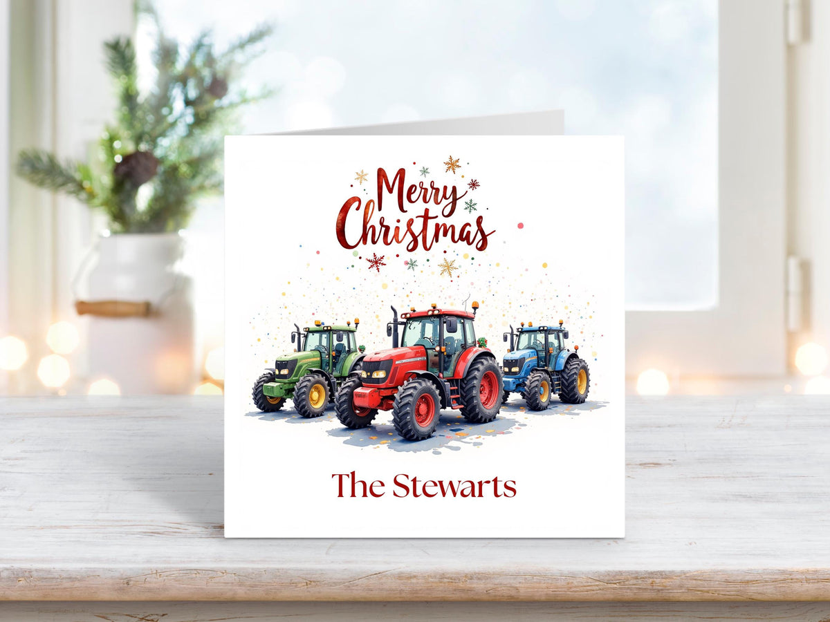 Christmas card with three colourful tractors in red, green and blue, festive confetti in the background, the words “Merry Christmas” above, and a personalised family name below reading “The Stewarts.”