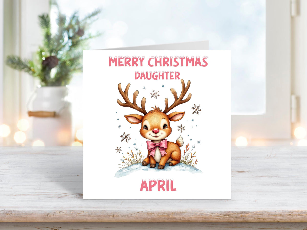 Personalised Christmas card for daughter with a cute reindeer wearing a pink bow on a white background