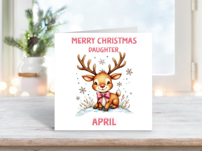 Personalised Christmas card for daughter with a cute reindeer wearing a pink bow on a white background