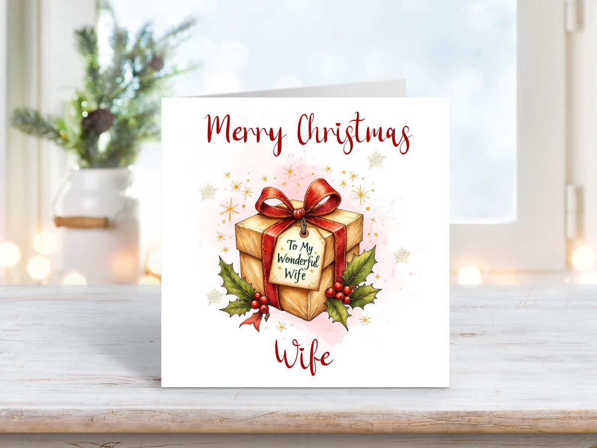 Christmas card for wife showing a gift wrapped present with tag reading “To My Wonderful Wife”, surrounded by holly and berries.