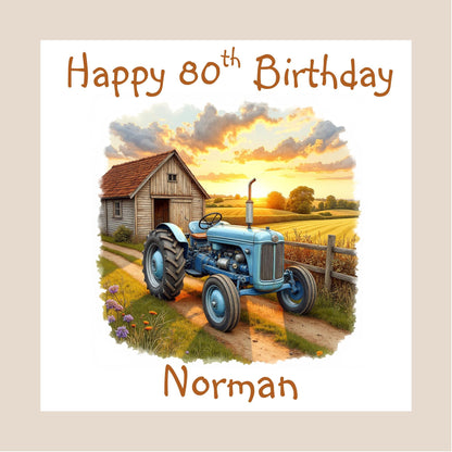 Personalised birthday card featuring a 1940s inspired vintage blue tractor beside a wooden barn at sunset in the countryside