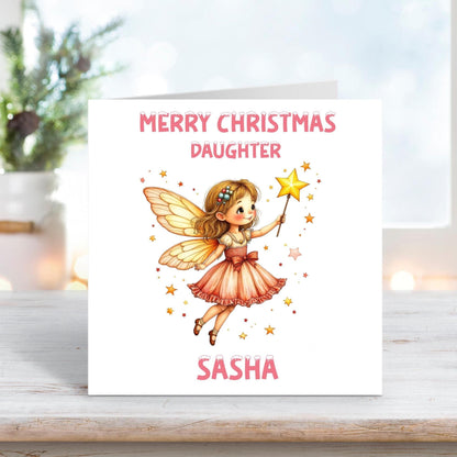 Personalised Christmas card for daughter featuring a fairy in a pink dress holding a magic wand, white background