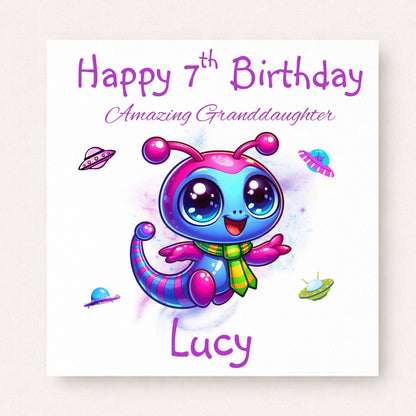 Personalised 7th birthday card for granddaughter featuring a cute colourful pink and blue alien with spaceships, customised with her name.